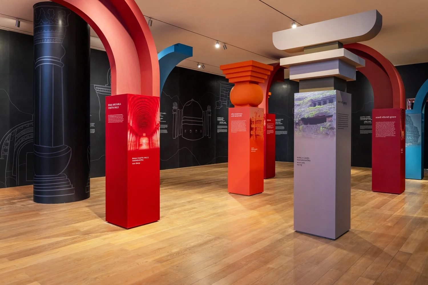 Colorful exhibition gallery with architectural displays and a timeline