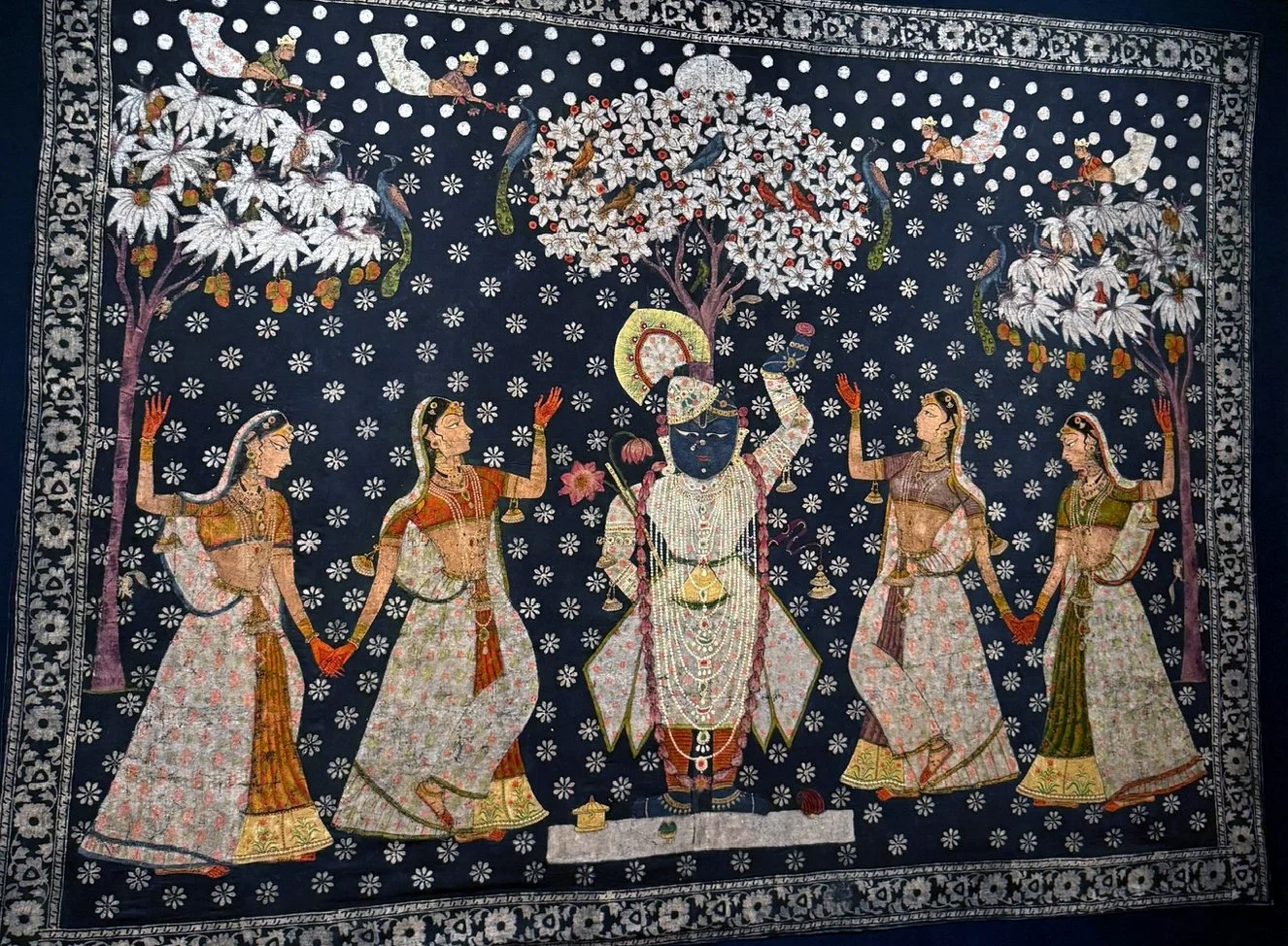 Raas Leela textile painting showing Krishna dancing with the gopis