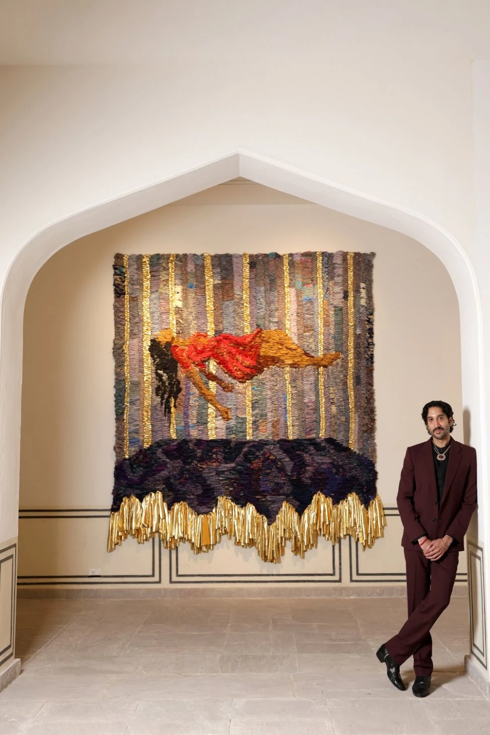 Rajiv Menon beside a work at the opening of Non-Residency