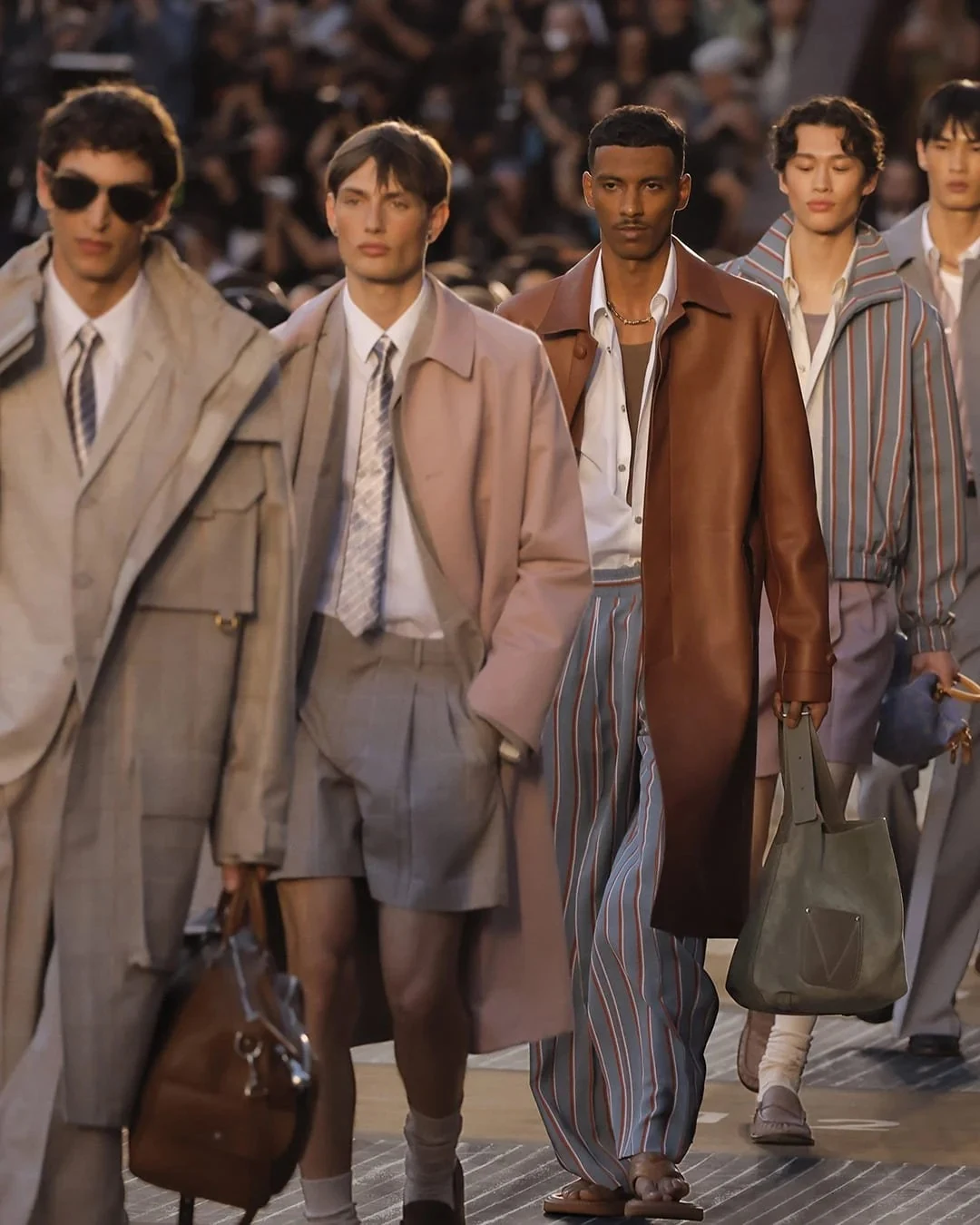 Models in relaxed tailoring at the Louis Vuitton runway finale