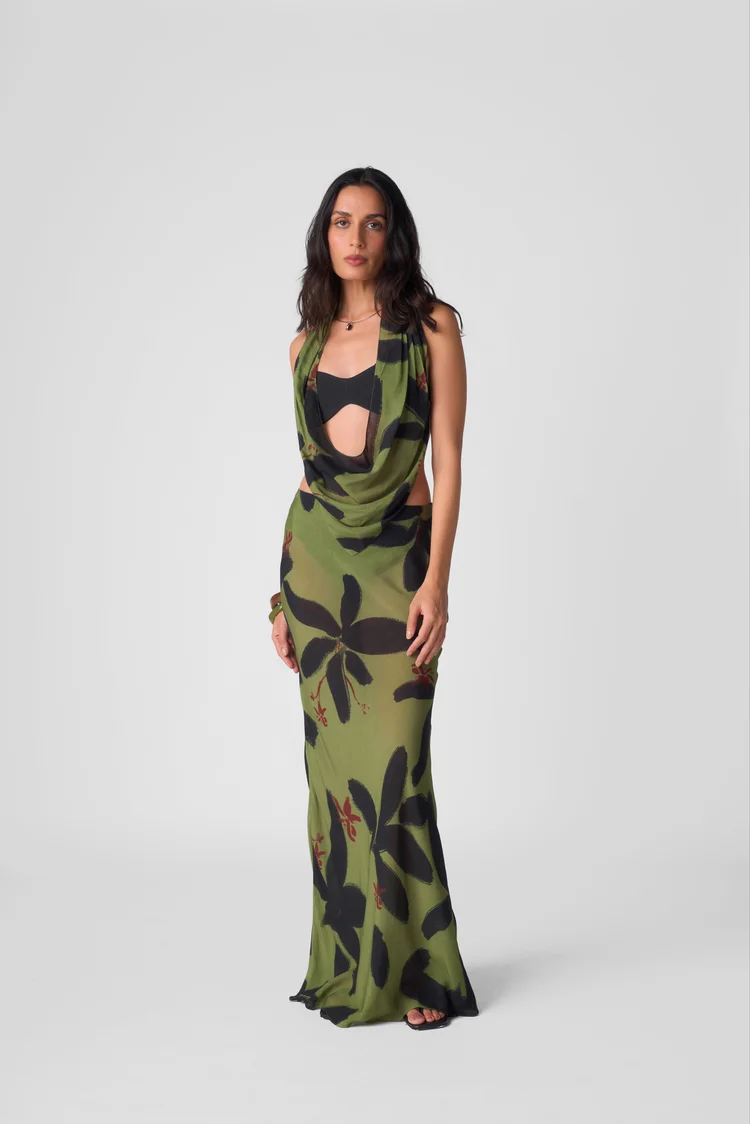 Model in a green floral dress